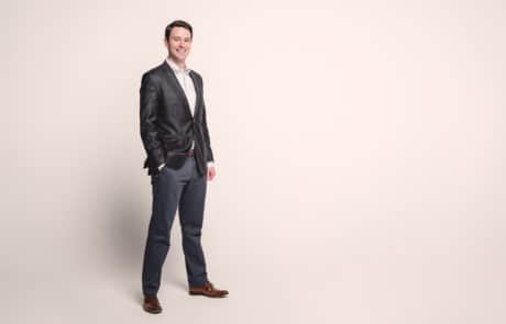 Peter Lazaroff standing in studio Peter Lazaroff in suit