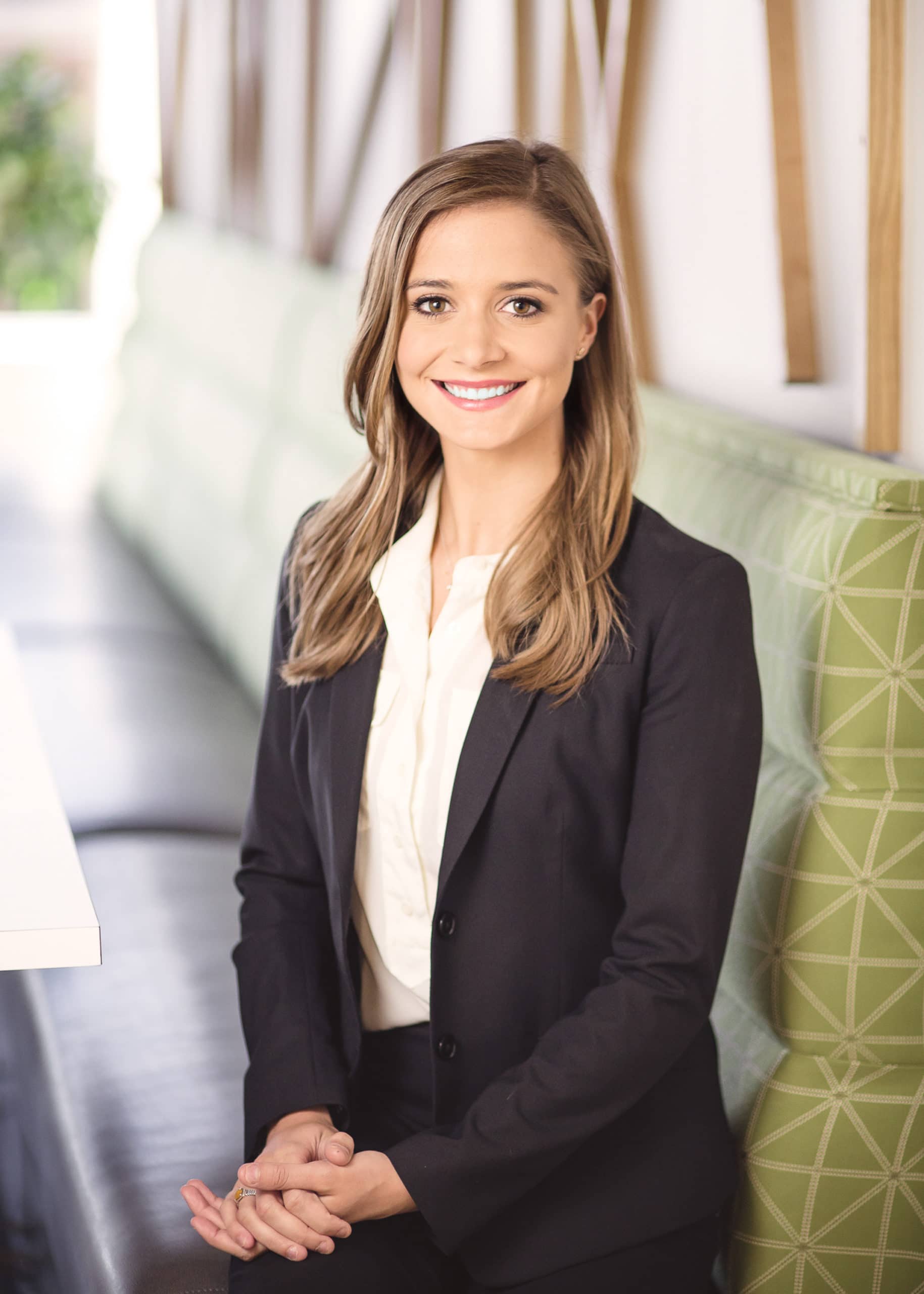 Woman in office portrait woman in business suit seated upright