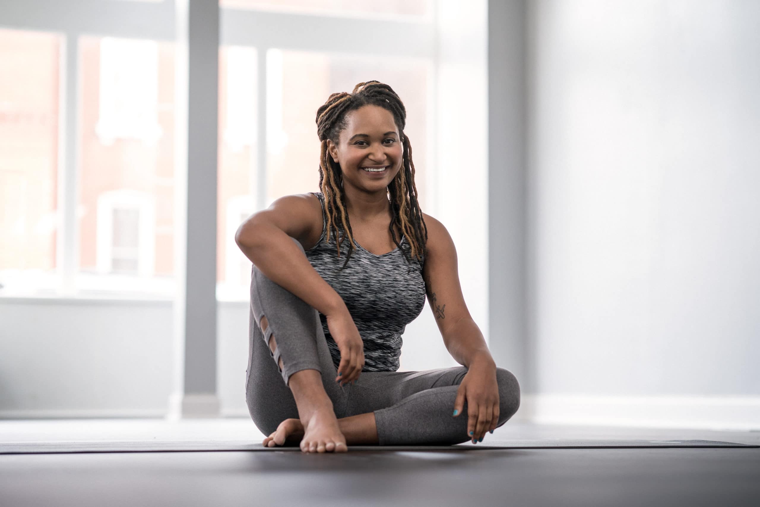yoga portrait in studio woman in yoga wear sitting