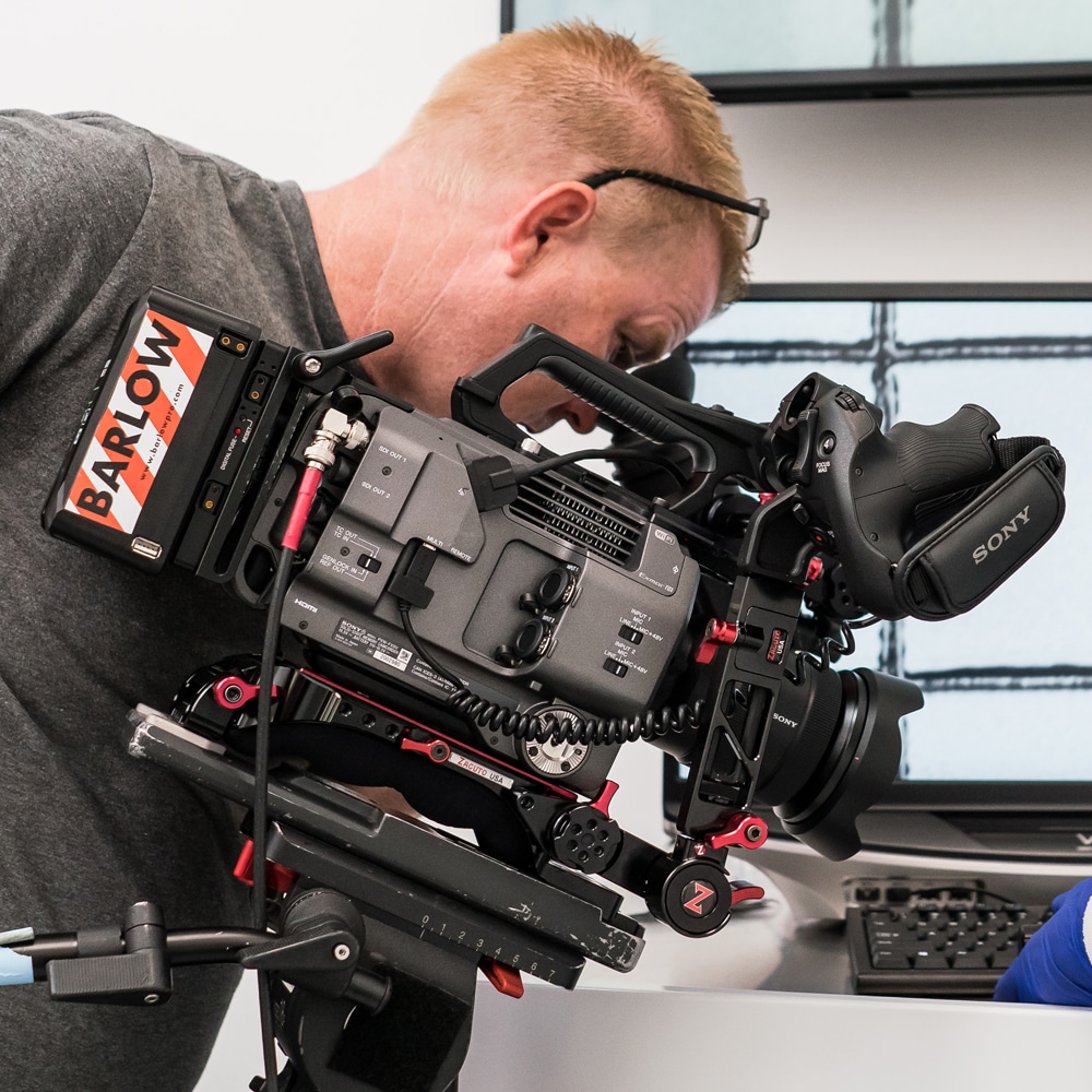 cinematographer holding video camera