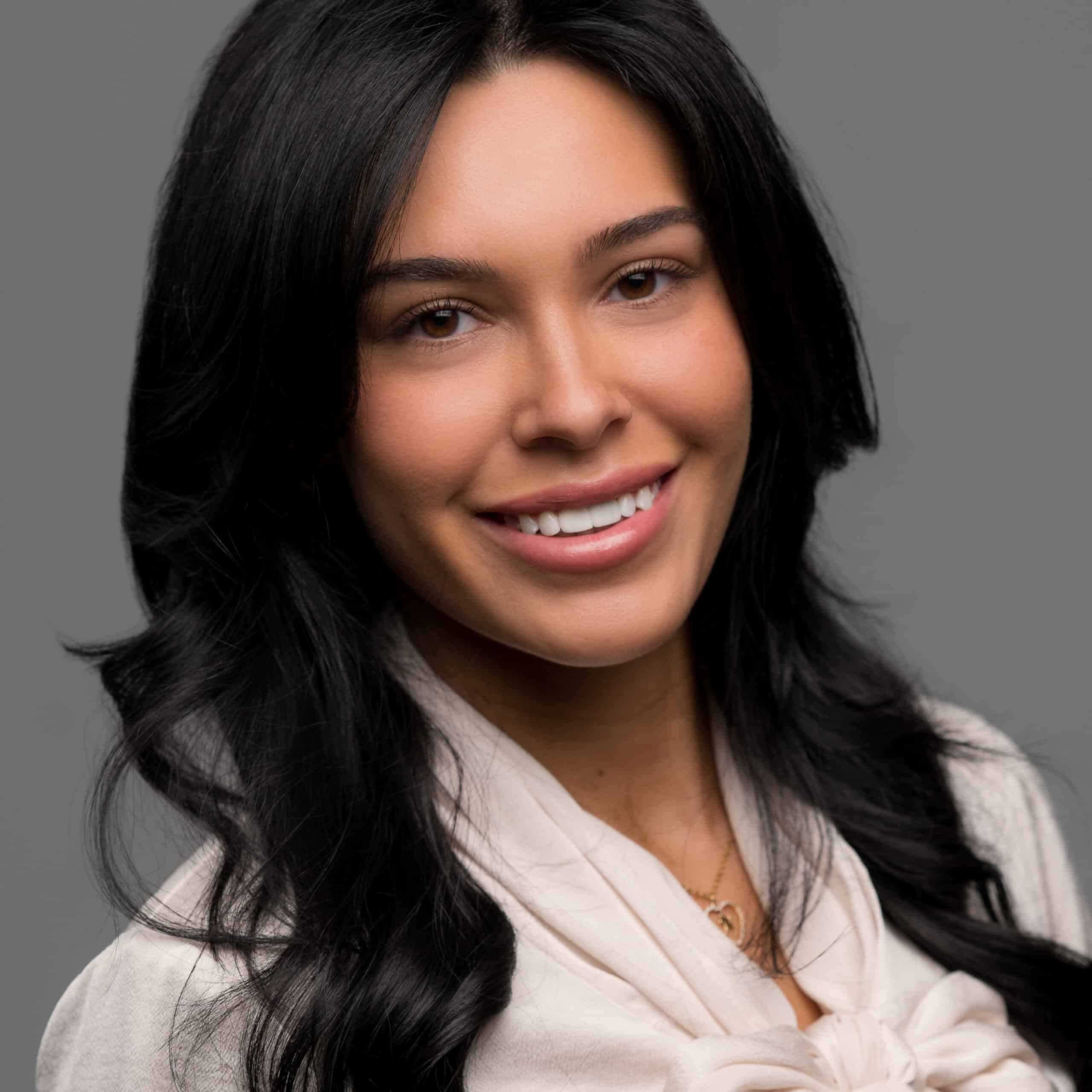 Smiling Woman in Studio Woman smiling gray background