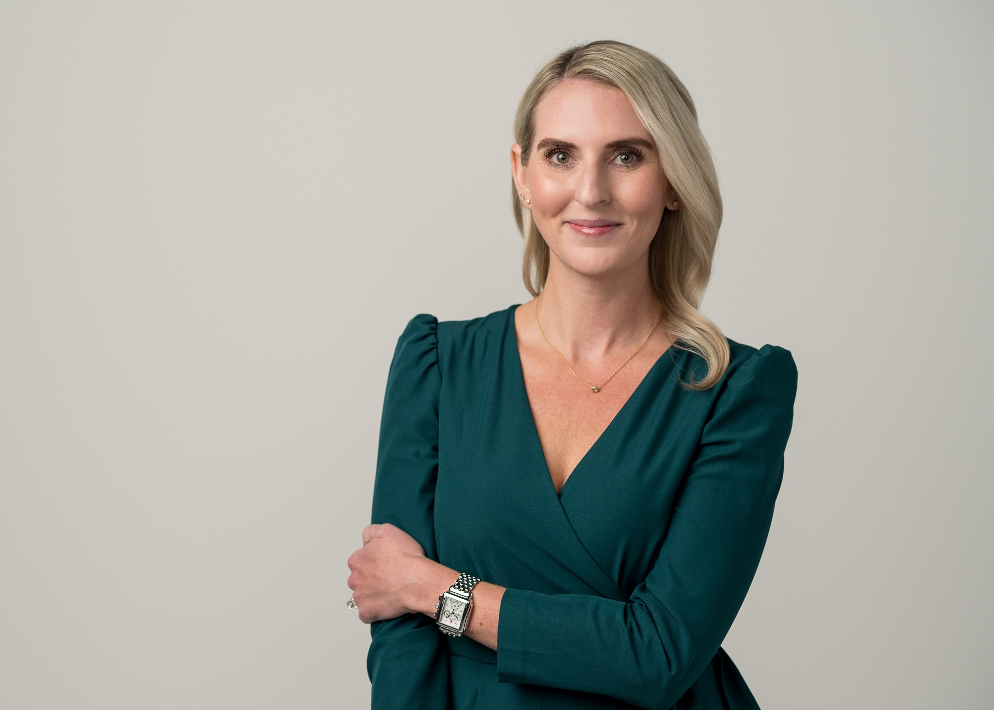Woman in studio portrait Casual woman holding arm