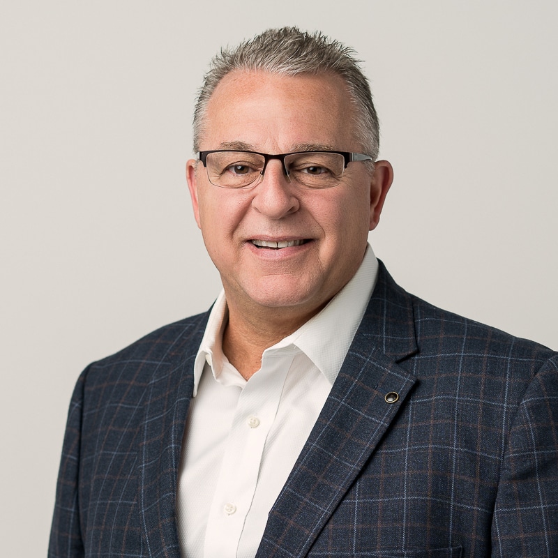 Business portrait of man in suit jacket man with glasses wearing sportcoat and smiling