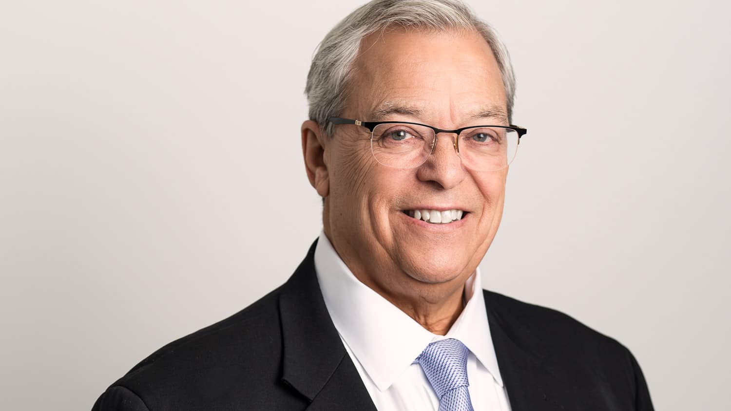 Smiling man wearing suit and tie