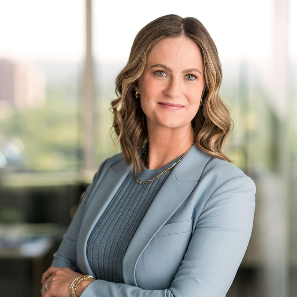 A woman in a summer suit photographed in a bright and airy St. Louis office